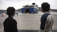 Two young Eritreans wait to board a ferry at Samos Island, Greece. Growing numbers of Eritreans are seeking asylum in Europe. (A. D'Amato/UNHCR)