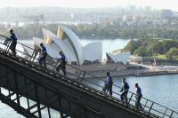 Tourists climbing Sydney Harbour Bridge