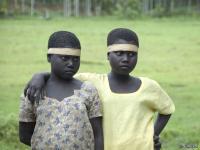Two Jarawa girls in clothes given to them by outsiders. Encroachment onto their land risks exposing the Jarawa to diseases to which they have no immunity. © Survival