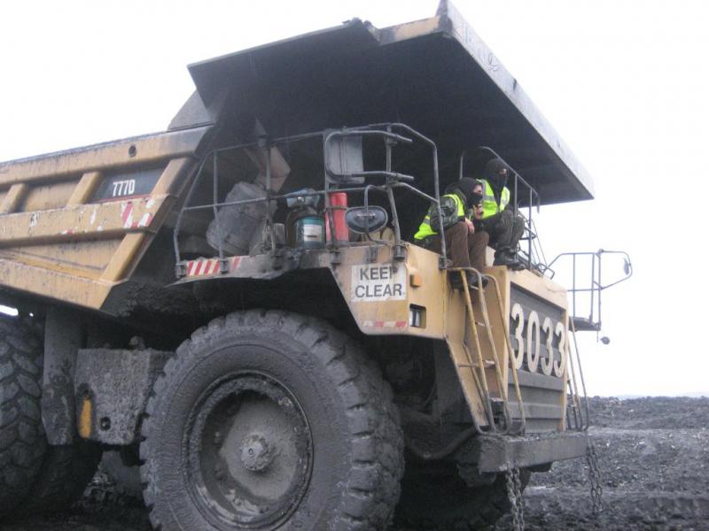 Digger divers aboard dumper truck