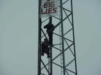 Activists with the banner on the tower next to Stora Enso's stockholder meeting.