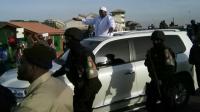 Barrow was driven in a motorcade after arriving in Banjul [Afolabi Sotunde/Reuters]