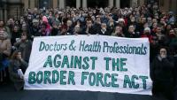 Doctors and other health professionals at a Sydney protest last year. They clamped their hands over their mouths to indicate they are being silenced by new laws threatening jail if they whistleblow maltreatment of refugees.