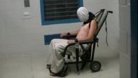 Teenager Dylan Voller spit-hooded and strapped to a mechanical restraint chair in Northern Territory detention.