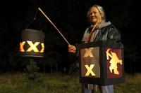 Woman with X lantern