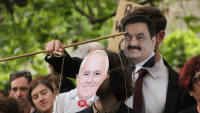 Australian protesters wear masks of prime minister Malcolm Turnbull and chairman of Adani Enterprises Gautam Adani - photo John Englart