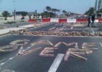 Anti-government demonstrators block the King Faisal Road to Bahrain Financial Harbour [Image from yfrog